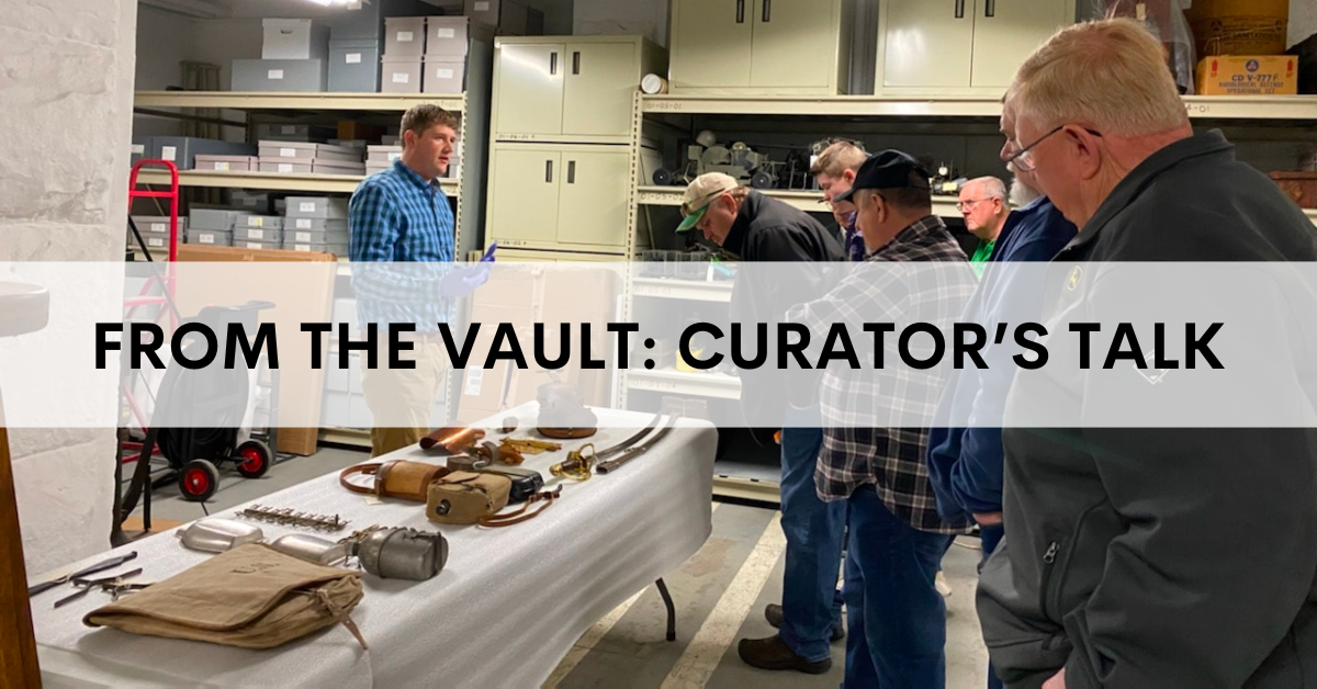 Rock Island Arsenal Museum Director Patrick Allie showing artifacts from the collection to visitors during a "From the Vault" curator talk